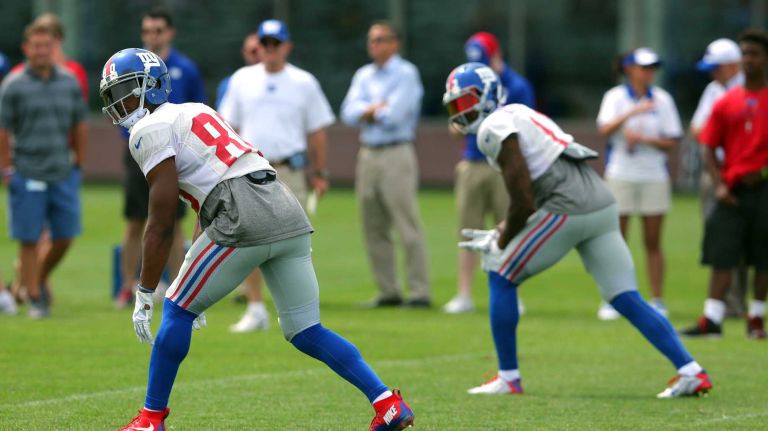 New York Giants wide receivers Victor Cruz and Odell Beckham Jr. line up for a play during training camp at the Quest Diagnostics Training Center in East Rutherford, N.J., on Saturday, Aug. 8, 2015.
