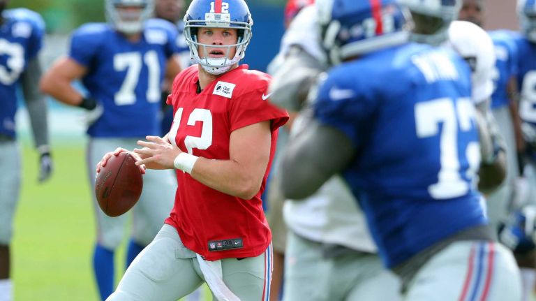 New York Giants quarterback Ryan Nassib scrambles while looking for a receiver during training camp at the Quest Diagnostics Training Center in East Rutherford, N.J., on Saturday, Aug. 8, 2015.