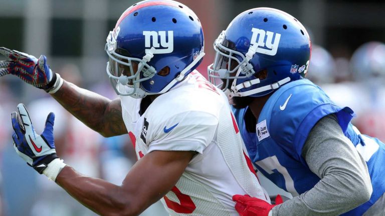New York Giants wide receiver Julian Talley can't catch a pass while being defended by Trevin Wade during training camp at the Quest Diagnostics Training Center in East Rutherford, N.J. on Thursday, Aug. 6, 2015.