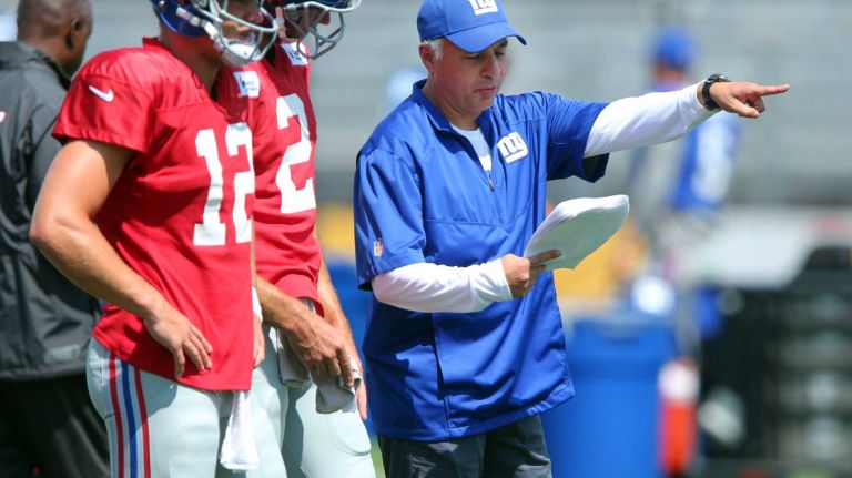New York Giants quarterbacks coach Mike Sullivan, right, works with quarterbacks Ryan Nassib and Ricky Stanzi during training camp at the Quest Diagnostics Training Center in East Rutherford, N.J., on Wednesday, Aug. 5, 2015.