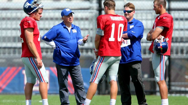 New York Giants quarterbacks coach Mike Sullivan, second from left, works with quarterbacks Ryan Nassib and Eli Manning, offensive coordinator Ben McAdoo and quarterback Ricky Stanzi during training camp at the Quest Diagnostics Training Center in East Rutherford, N.J., on Wednesday, Aug. 5, 2015.