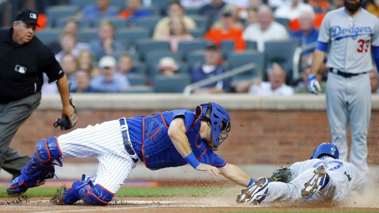 Howie Kendrick #47 of the Los Angeles Dodgers dives home for a first-inning run ahead of the tag from Kevin Plawecki #22 of the Mets at Citi Field on Friday, July 24, 2015.