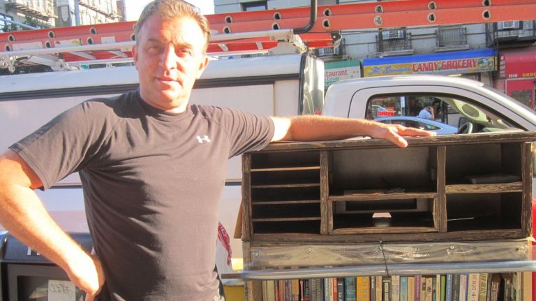 Kevin Klepper voluntarily installs and maintains public bookshelveson the streets of Washington Heights and Inwood. 