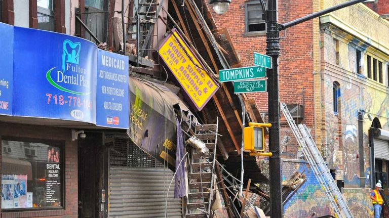A four-story building at 1438 Fulton St. in the Bed-Stuy section of Brooklyn, collapsed just before 2:30 p.m. on Tuesday, July 14, 2014. The FDNY says three people were treated for non-life-threatening injuries.