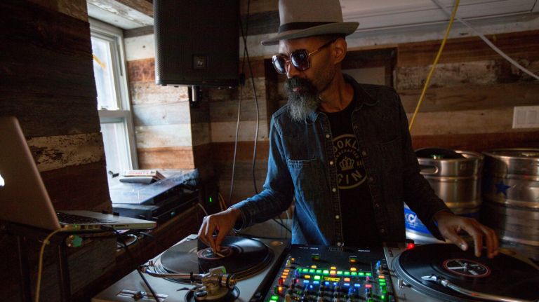 Bed-Vyne Brew opened in Bedford-Stuyvesant  in June 2013 and features regular DJs such as Dick Burroughs, seen here.