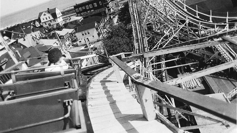 The roller coaster at Rockaways' Playland gives a view of the neighborhood below on July 3, 1979.