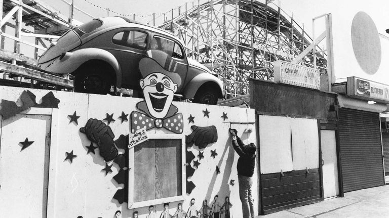 Joe Prout, a maintenance man at Rockaways' Playland, adjusts door hinge on the premises. (April 3, 1986)