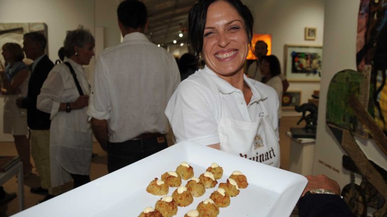 Sandra Bullocks serves goodies attends the Art Southampton VIP first view & VIP preview to benefit Southampton Hospital & Parrish Art Museum in Water Mill, Thursday, July 9, 2015. The art show runs from July 9 through July 13.