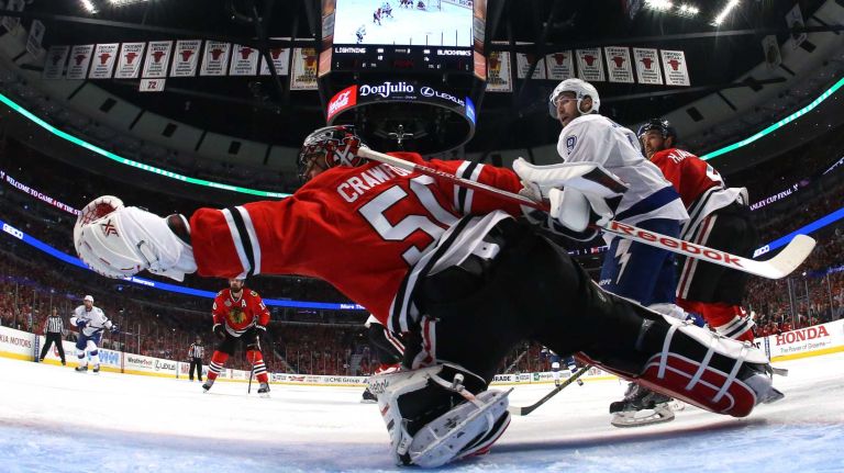 CHICAGO, IL - JUNE 10: Corey Crawford #50 of the Chicago Blackhawks stretches to make a save in the third period against the Tampa Bay Lightning during Game Four of the 2015 NHL Stanley Cup Final at the United Center on June 10, 2015 in Chicago, Illinois. (Photo by Bruce Bennett/Getty Images)