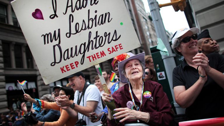 Frances Goldin, who has two lesbian daughters, holds a sign while watching the Gay Pride Parade on June 28, 2015 in New York City. 