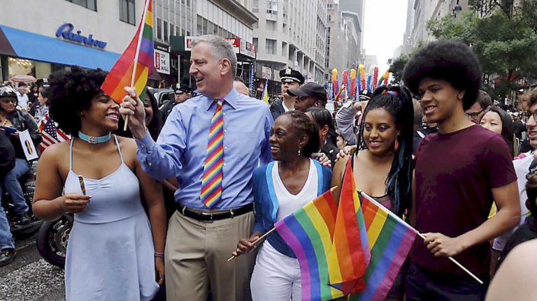 New York City Mayor Bill de Blasio gets ready to step off with his wife Chirlane McCray, and his children -- Chiara and Dante -- during the 2015 New York City Pride March on Sunday, June 28, 2015, in Manhattan. 