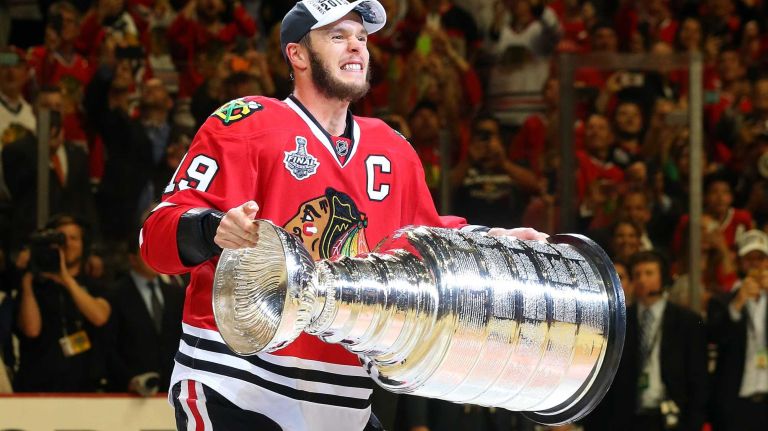 Stanley Cup Final: Blackhawks vs. Lightning 28 CHICAGO, IL - JUNE 15: Jonathan Toews #19 of the Chicago Blackhawks celebrates by hoisting the Stanley Cup after defeating the Tampa Bay Lightning by a score of 2-0 in Game Six to win the 2015 NHL Stanley Cup Final at the United Center on June 15, 2015 in Chicago, Illinois. (Photo by Bruce Bennett/Getty Images)