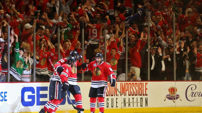 Stanley Cup Final: Blackhawks vs. Lightning 30 CHICAGO, IL - JUNE 15: Duncan Keith #2 of the Chicago Blackhawks celebrates with teammate Brandon Saad #20 and Patrick Kane #88 after scoring a goal in the second period against Ben Bishop #30 of the Tampa Bay Lightning during Game Six of the 2015 NHL Stanley Cup Final at the United Center on June 15, 2015 in Chicago, Illinois. (Photo by Bruce Bennett/Getty Images)