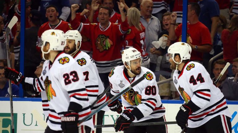 Stanley Cup Final: Blackhawks vs. Lightning 38 TAMPA, FL - JUNE 13: Antoine Vermette #80 of the Chicago Blackhawks celebrates with his teammates after scoring a goal in the third period against the Tampa Bay Lightning during Game Five of the 2015 NHL Stanley Cup Final at Amalie Arena on June 13, 2015 in Tampa, Florida. (Photo by Bruce Bennett/Getty Images)
