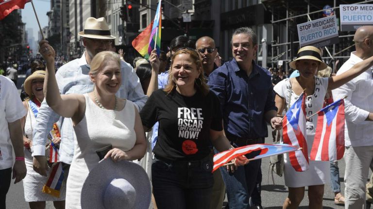 U.S. Senator Kirsten Gellibrand, left, and New York City Council Speaker Melissa Mark-Viverito, second from left, march along 5th Avenue during the 58th annual Puerto Rican Day Parade in Manhattan on June 14, 2015. The annual parade celebrates Puerto Rican heritage and culture. It is one of the largest parades in New York City.