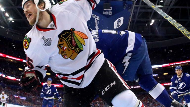 TAMPA, FL - JUNE 06: Andrew Shaw #65 of the Chicago Blackhawks scores a goal against Ben Bishop #30 of the Tampa Bay Lightning during the second period in Game Two of the 2015 NHL Stanley Cup Final at Amalie Arena on June 6, 2015 in Tampa, Florida. (Photo by Bruce Bennett/Getty Images)