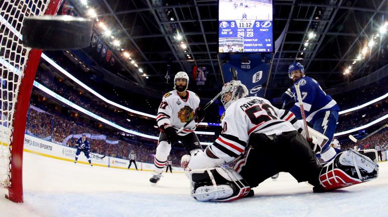 TAMPA, FL - JUNE 06: Corey Crawford #50 of the Chicago Blackhawks gives up a third period goal to Jason Garrison #5 of the Tampa Bay Lightning during Game Two of the 2015 NHL Stanley Cup Final at Amalie Arena on June 6, 2015 in Tampa, Florida. (Photo by Bruce Bennett/Getty Images)