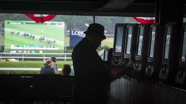 Racegoers at the kiosks hours before the Belmont Stakes in Elmont on Saturday, June 6, 2015.