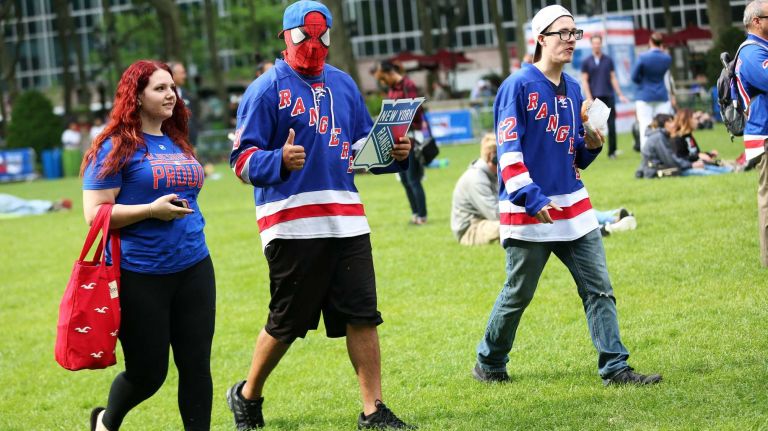 Rangers viewing party in Bryant Park 10 Samantha Kearney of Old Bridge, N.J., Mike Calabrese of Staten Island, and John Carmichael of Staten Island enjoy the free Rangers' outdoor viewing party in Bryant Park in Manhattan on Wednesday, May 20, 2015.