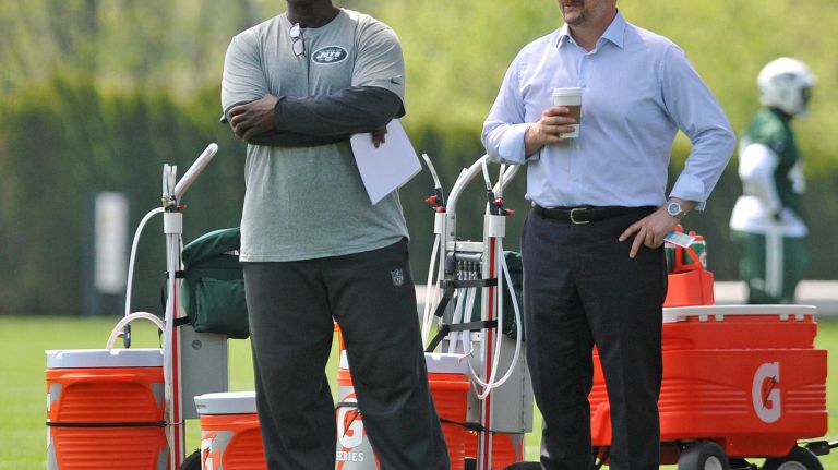 New York Jets head coach Todd Bowles, left, and general manager Mike Maccagnan observe the action during Day 1 of rookie minicamp held at Atlantic Health Jets Training Center in Florham Park, N.J. on Friday, May 8, 2015.