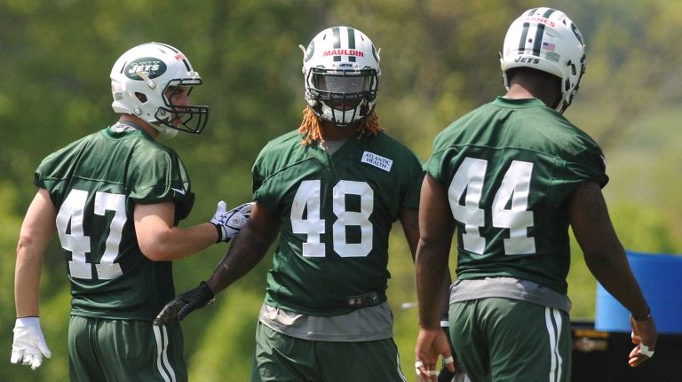 New York Jets LB Lorenzo Mauldin, the team's third-round selection (82nd overall) in the 2015 NFL Draft, center, practices during Day 1 of rookie minicamp held at Atlantic Health Jets Training Center in Florham Park, N.J. on Friday, May 8, 2015.