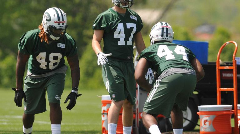 New York Jets LB Lorenzo Mauldin, the team's third-round selection (82nd overall) in the 2015 NFL Draft, left, practices during Day 1 of rookie minicamp held at Atlantic Health Jets Training Center in Florham Park, N.J. on Friday, May 8, 2015.