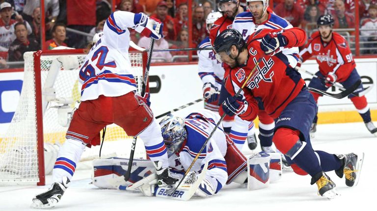 New York Rangers goalie Henrik Lundqvist makes a save on Alex Ovechkin #8 of the Washington Capitals during the first period in Game 3 of the Eastern Conference semifinals during the 2015 NHL Stanley Cup playoffs at Verizon Center on May 4, 2015.