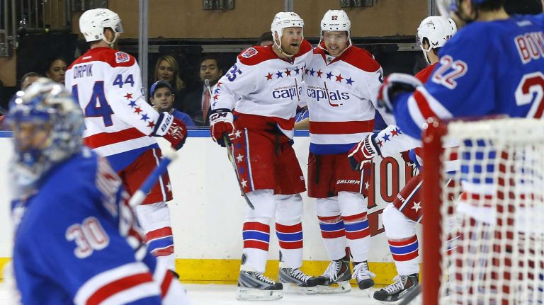 Rangers vs. Capitals: Game 2 of round 2 of Stanley Cup playoffs 32 Evgeny Kuznetsov #92 of the Washington Capitals celebrates his second-period goal against Henrik Lundqvist #30 of the New York Rangers with teammate Jason Chimera #25 during Game 2 of the Eastern Conference semifinals at Madison Square Garden on Saturday, May 2, 2015.