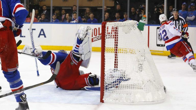 Rangers vs. Capitals: Game 2 of round 2 of Stanley Cup playoffs 33 Henrik Lundqvist #30 of the New York Rangers rolls over after making a save in the second period against Evgeny Kuznetsov #92 of the Washington Capitals during Game 2 of the Eastern Conference semifinals at Madison Square Garden on Saturday, May 2, 2015.