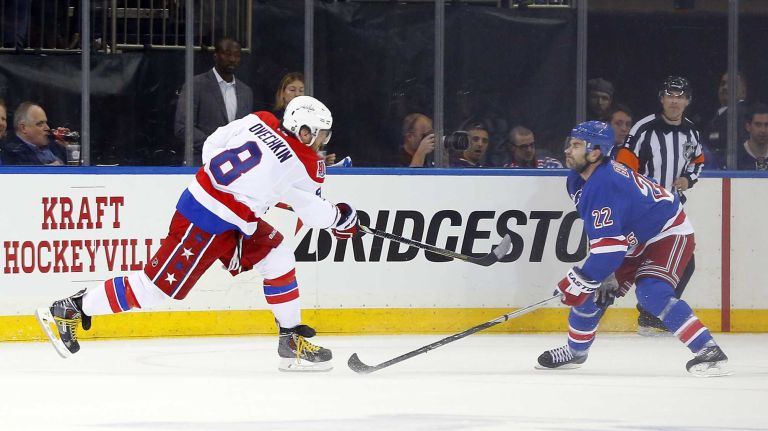 Alex Ovechkin #8 of the Washington Capitals takes a shot past Dan Boyle #22 of the New York Rangers for a first-period power-play goal during Game 1 of the Eastern Conference semifinals at Madison Square Garden on Thursday, April 30, 2015.