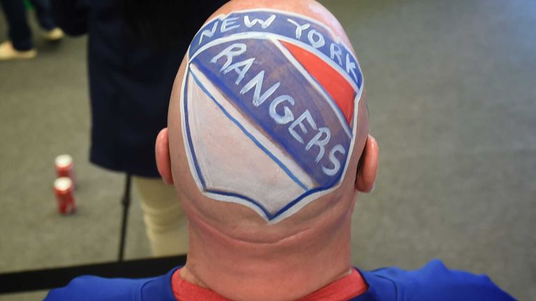 New York Rangers fans Anthony Simone, of Queens, shows his team pride before Game 1 of the Eastern Conference semifinals against the Washington Capitals in the Stanley Cup playoffs at Madison Square Garden on Thursday, April 30, 2015.