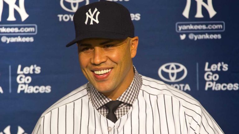 Carlos Beltran speaks to members of the media after being introduced as the newest Yankee during a press conference at Yankee Stadium. (Dec. 20, 2013)