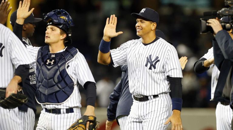 Alex Rodriguez #13 of the New York Yankees celebrates with his teammates after defeating the New York Mets at Yankee Stadium on Sunday, April 26, 2015.