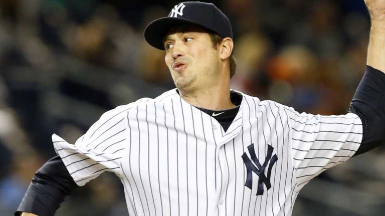 Andrew Miller of the New York Yankees pitches in the ninth inning against the New York Mets at Yankee Stadium on Sunday, April 26, 2015.