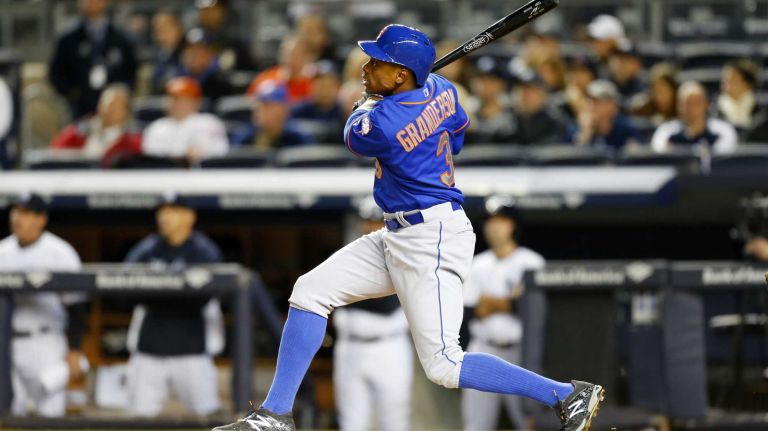 Curtis Granderson #3 of the New York Mets follows through on a first-inning home run against the New York Yankees at Yankee Stadium on Sunday, April 26, 2015.