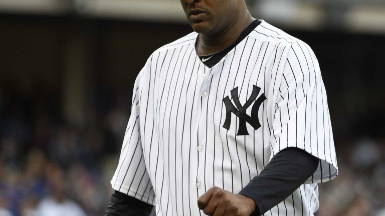 New York Yankees starting pitcher CC Sabathia walks to the dugout after being taken out of the game during the sixth inning against the New York Mets in a baseball game at Yankee Stadium on Saturday, April 25, 2015.