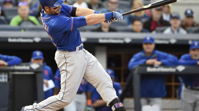 New York Mets catcher Kevin Plawecki hits a two-run home run during the fourth inning against the New York Yankees in a baseball game at Yankee Stadium on Saturday, April 25, 2015.