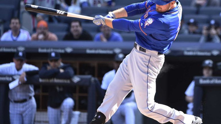 New York Mets first baseman Lucas Duda hits a solo home run against the New York Yankees during the first inning of a baseball game at Yankee Stadium on Saturday, April 25, 2015.