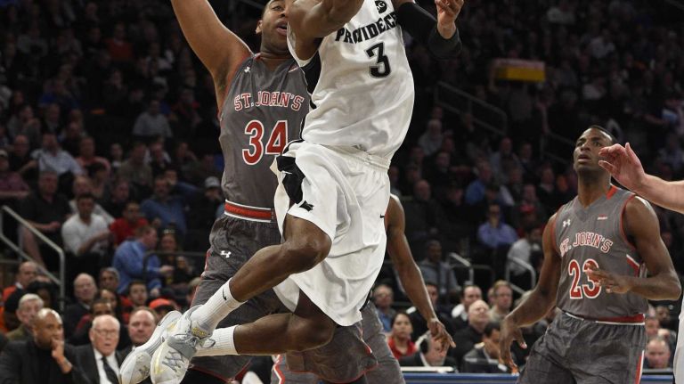 Big East Tournament quarterfinal: St. John's vs. Providence 23 Providence Friars guard Kris Dunn attempts a shot ahead of St. John's Red Storm center Joey De La Rosa in a Big East quarterfinal men's basketball game at Madison Square Garden on Thursday, March 12, 2015.