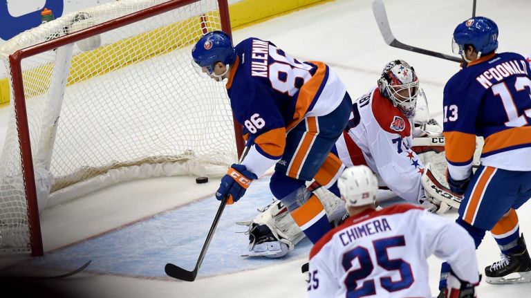 Eastern Conference quarterfinals Game 6: Islanders vs. Capitals 96 New York Islanders' Nikolay Kulemin puts the puck past Washington Capitals goalie Branden Holtby to score the winning goal in the third period during Game 6 of the Eastern Conference quarterfinals at Nassau Coliseum on Saturday, April 25, 2015.