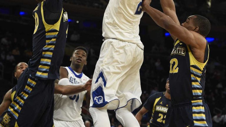 Big East Tournament first round: Marquette vs. Seton Hall 40 Seton Hall Pirates forward Brandon Mobley sinks his shot between Marquette Golden Eagles center Luke Fischer and Marquette Golden Eagles guard Derrick Wilson in the first round of the Big East basketball tournament at Madison Square Garden on Wednesday, March 11, 2015.