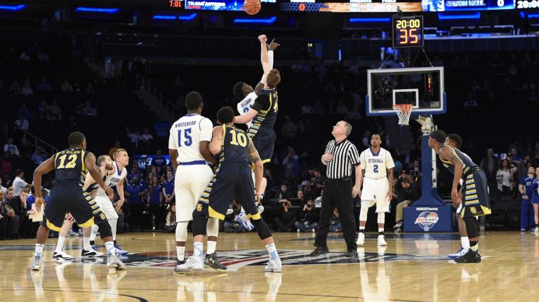Big East Tournament first round: Marquette vs. Seton Hall 41 Marquette Golden Eagles center Luke Fischer takes the opening tipoff against Seton Hall Pirates forward Angel Delgado in the first round of the Big East basketball tournament at Madison Square Garden on Wednesday, March 11, 2015.
