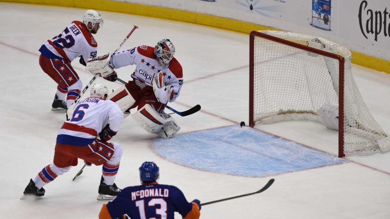 Eastern Conference quarterfinals Game 6: Islanders vs. Capitals 102 Washington Capitals goalie Branden Holtby watches the puck get past him but not go in the net against the New York Islanders in the second period during Game 6 of the Eastern Conference quarterfinals at Nassau Coliseum on Saturday, April 25, 2015.