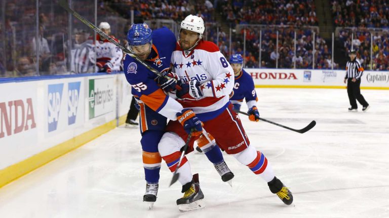 Eastern Conference quarterfinals Game 6: Islanders vs. Capitals 104 Johnny Boychuk of the New York Islanders battles for the puck in the first period against Alex Ovechkin of the Washington Capitals during Game 6 of the Eastern Conference quarterfinals at Nassau Coliseum on Saturday, April 25, 2015.