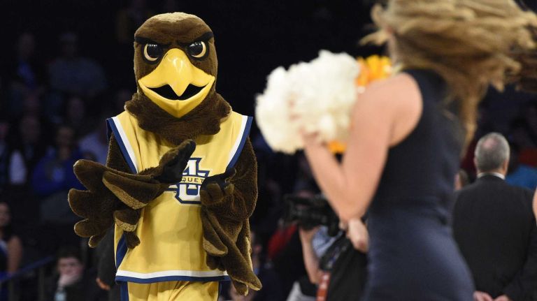 Big East Tournament first round: Marquette vs. Seton Hall 51 Tme Marquette Golden Eagles mascot cheers during a timeout against the Seton Hall Pirates in the first round of the Big East basketball tournament at Madison Square Garden on Wednesday, March 11, 2015.