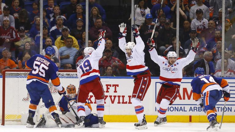 Eastern Conference quarterfinals Game 6: Islanders vs. Capitals 112 Nicklas Backstrom, Troy Brouwer and Marcus Johansson of the Washington Capitals celebrate a first-period goal against Jaroslav Halak of the New York Islanders scored by teammate John Carlson (not pictured) during Game 6 of the Eastern Conference quarterfinals at Nassau Coliseum on Saturday, April 25, 2015.