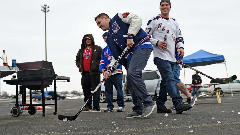 Fans at Islanders vs. Rangers 45 Rangers fan Justin Bracken of Bethpage takes a shot as he tailgates in the parking lot of Nassau Coliseum before the last Islanders-Rangers regular-season game at the Coliseum on March 10, 2015.