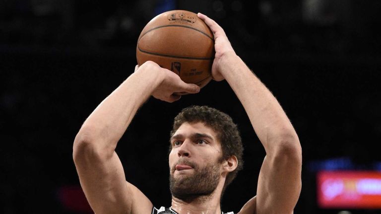 Brooklyn Nets center Brook Lopez shoots a free throw against the Boston Celtics in the second half of an NBA basketball game at Barclays Center on Wednesday, January 7, 2015. The Celtics defeated the Nets 89-81.