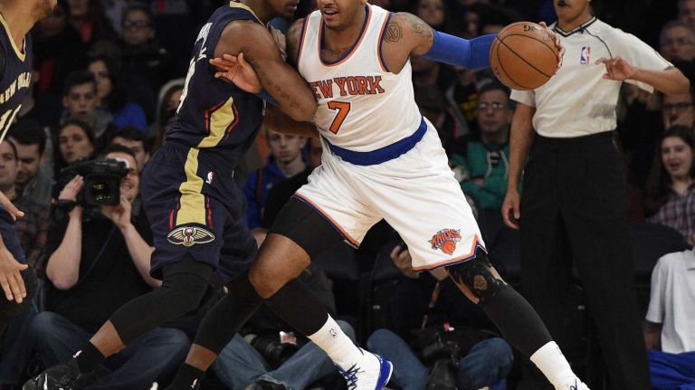 New York Knicks forward Carmelo Anthony drives against New Orleans Pelicans forward Dante Cunningham in the first half of an NBA game at Madison Square Garden on Monday, Jan. 19, 2015.