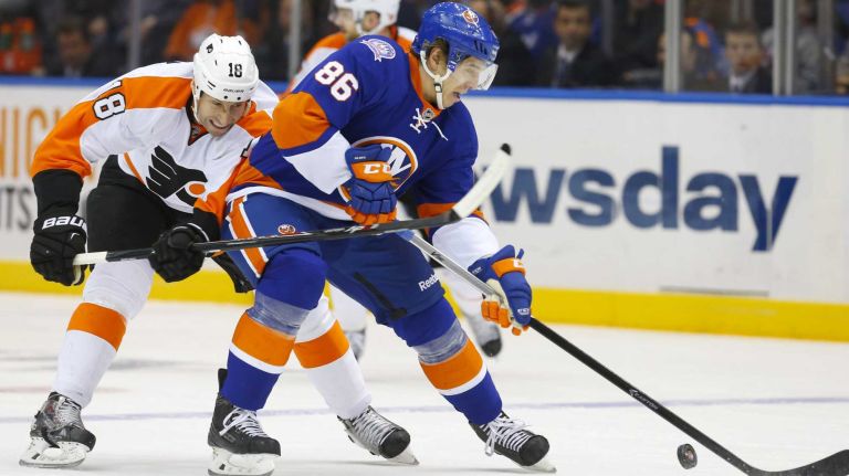 Islanders vs. Flyers 11 Nikolay Kulemin of the New York Islanders carries the puck in the first period against R.J. Umberger of the Philadelphia Flyers at Nassau Coliseum on January 19, 2015.